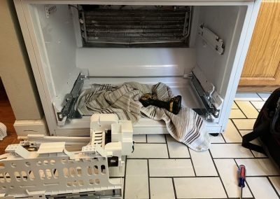 Clogged drain line in the freezer section causing leak from the bottom.